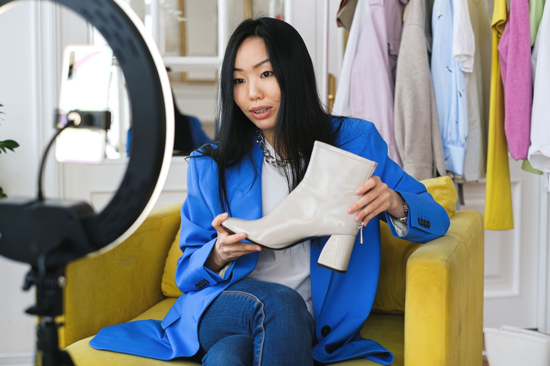Creator presenting a product to camera under a ring light